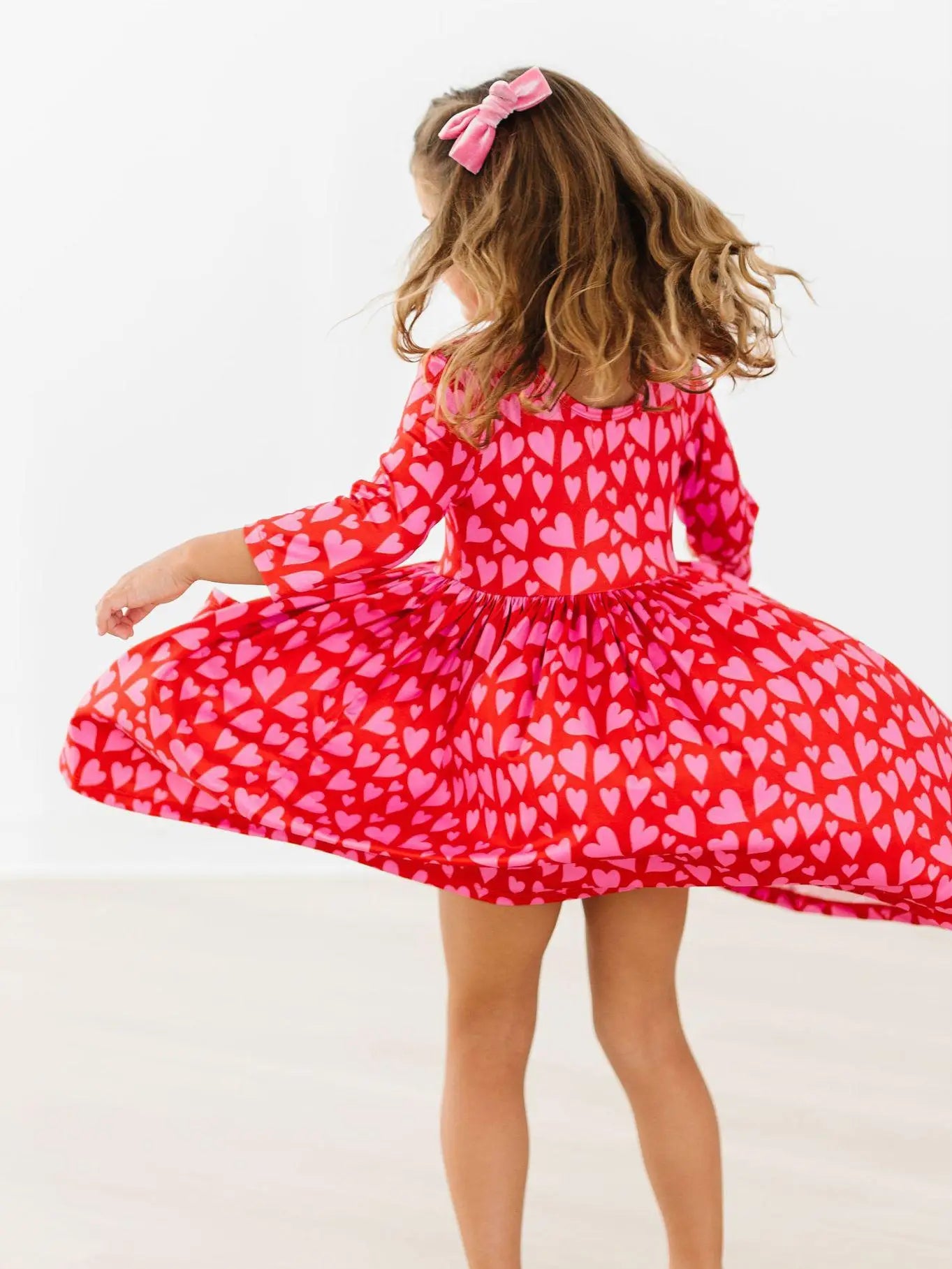 Mila & Rose | Hearts & Hugs 3/4 Sleeve Pocket Twirl Dress | Back | Vagabond | Apparel | Boutique