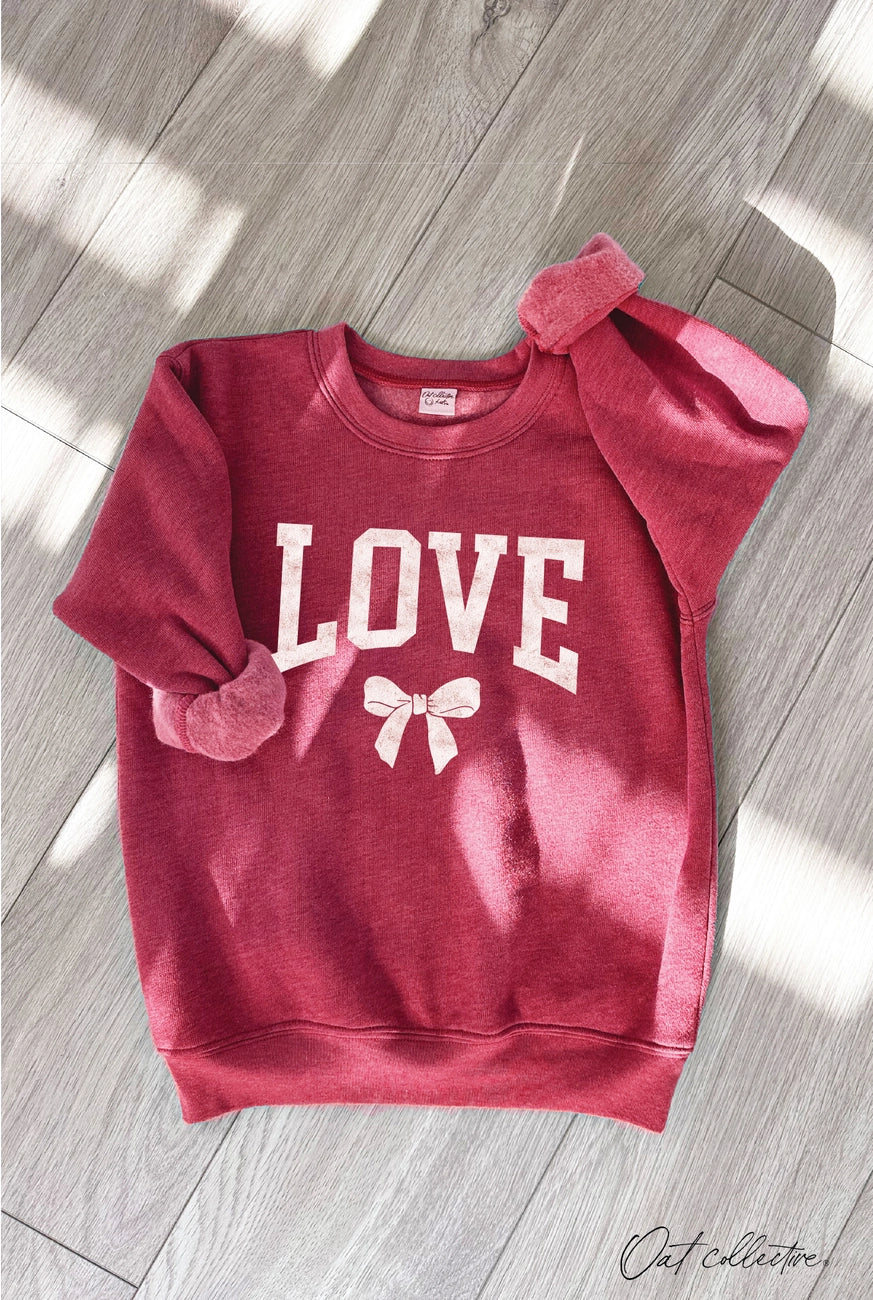 Oat Collective Kid | Love Bow Graphic Sweatshirt | Front | Vagabond | Apparel | Boutique