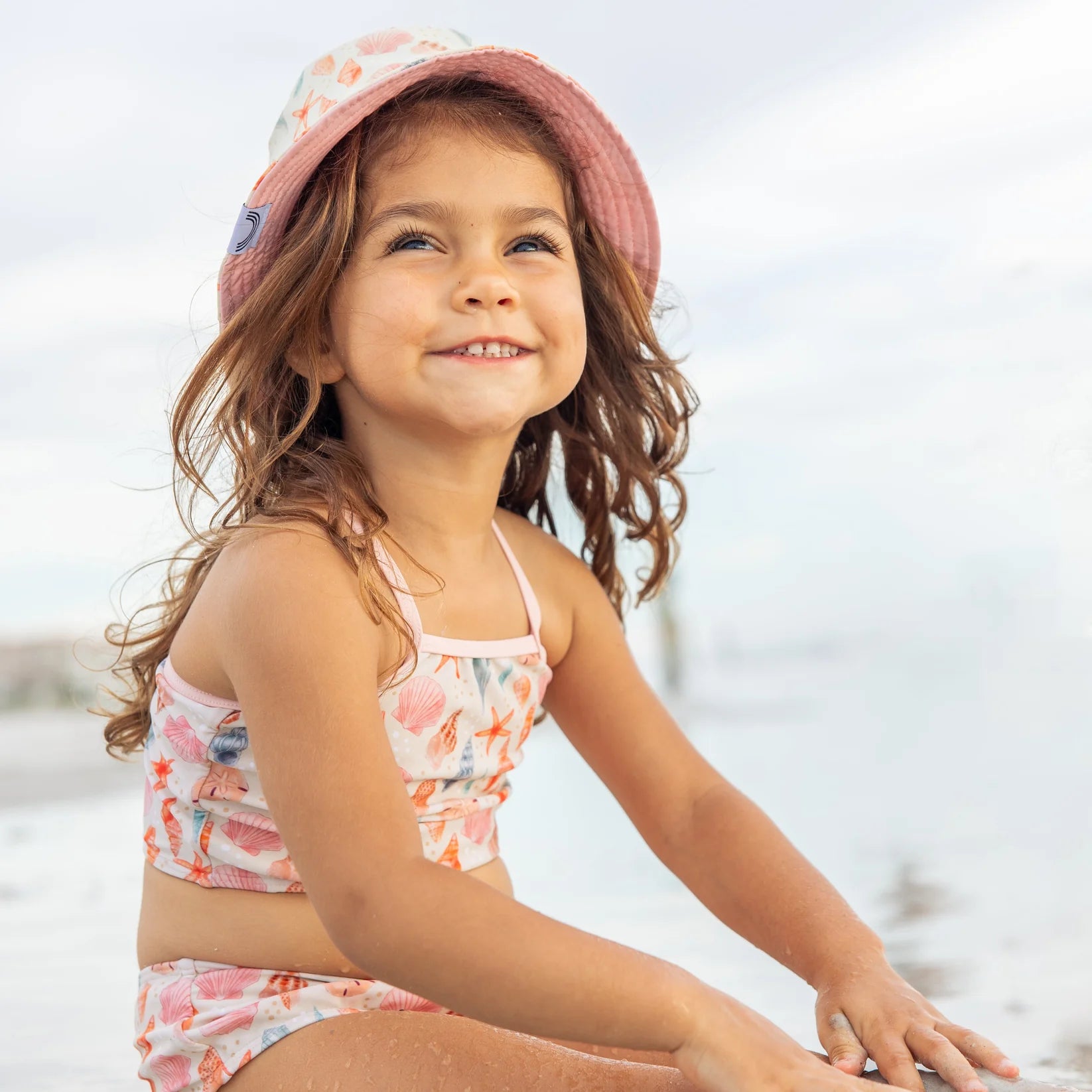 Emerson & Friends | Sandy Seashells Reversible Bucket Hat | Model | Vagabond | Apparel | Boutique