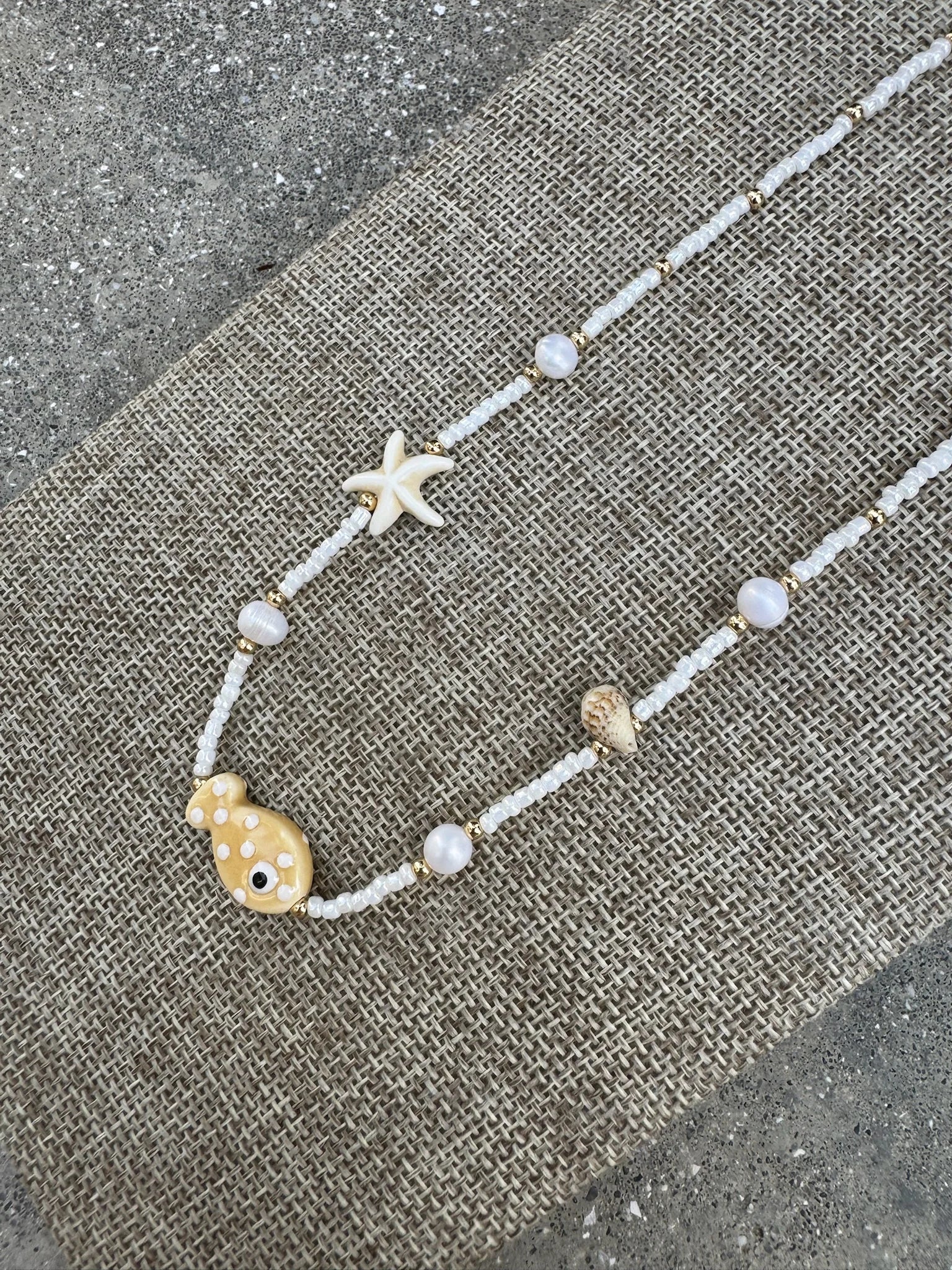 GSA | Pearl Bead Fish & Multi Charm Necklace | Side | Vagabond | Apparel | Boutique